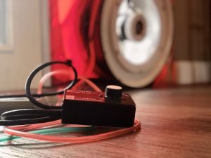 A blower door test machine and reader in operation in a home