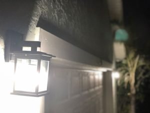 Photo of energy efficient outdoor lighting fixture at night from the First Attainable Home project.
