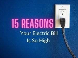 White electric outlet on a blue wall with a dark gray cord plugged in and the text "15 Reasons Your Electric Bill Is So High