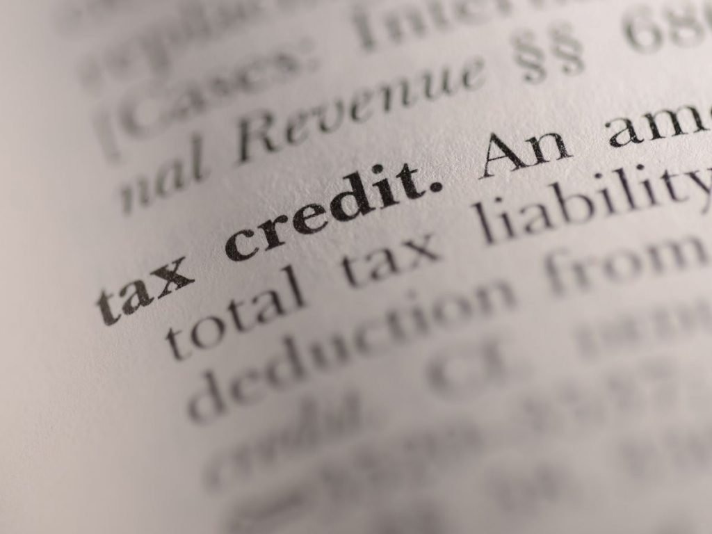 Closeup photo of a page of print with the words "tax credit" highlighted