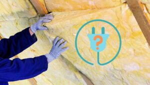 A picture of a person installing fiberglass insulation batts, with an electrical plug graphic on the right side, including a question mark symbol in the middle of it.
