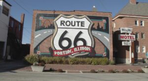 A mural of a highway displaying a Route 66 sign on a brick building in Pontiac, Illinois