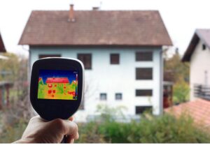 An Infrared Thermal Camera is used to record home heat loss outside a house