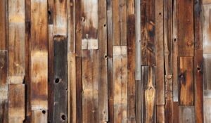 A closeup of slats of reclaimed wood flooring