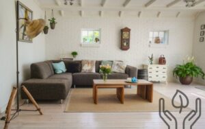 an earthy and modern sustainable looking living room, with a couch and decor in the middle of it