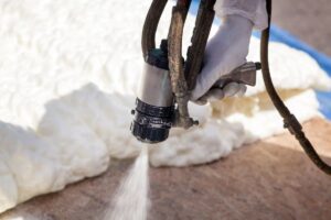 Spray foam insulation is applied with a spray gun