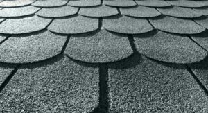 A closeup on some asphalt roof shingles on a home