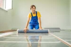 A homeowner installs an electric radiant floor – a type of electric heater – in his home