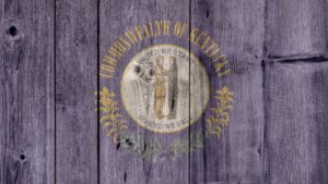 The Kentucky state seal stamped onto some distressed wooden boards