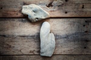 Two stones on a dock are used to form an outline of the state of Michigan