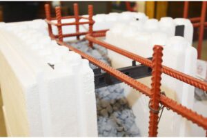 Up close view of an insulated concrete form block mold being readied to pour