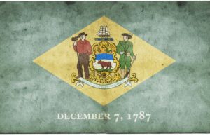 The state flag of Delaware seen on a rugged, textured background