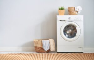 A washing machine against a wall in a home's laundry room