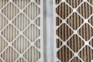A closeup on two furnace filters side-by-side