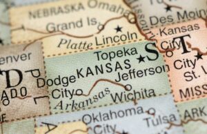 Closeup on a US map with the state of Kansas focused in the center of the photo