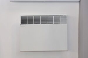 Closeup on an eco panel heater a wall in a home