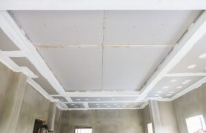 A ceiling is prepared to be converted to a low ceiling