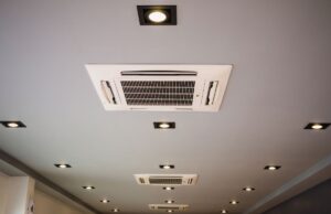 A ceiling with multiple ceiling-mounted mini-split air handler units installed