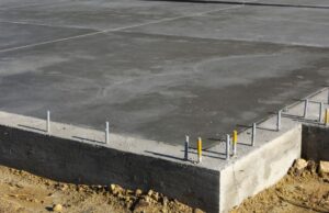 Closeup on the corner of a poured concrete foundation for a modular home