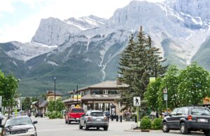 A downtown street view of a town in Alberta, Canada, bordering the mountains