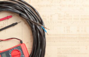 A coil of neutral wire with a charger beneath it