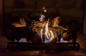 Closeup on a lit gas fireplace in a home