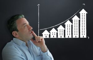 A homeowner pondering the appreciation value of a modular how with a graphic indicating increasing value transposed