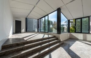 An open living space of a home with wall-to-wall hurricane windows