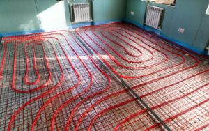 A hydronic radiant floor heating system installed on a living room floor
