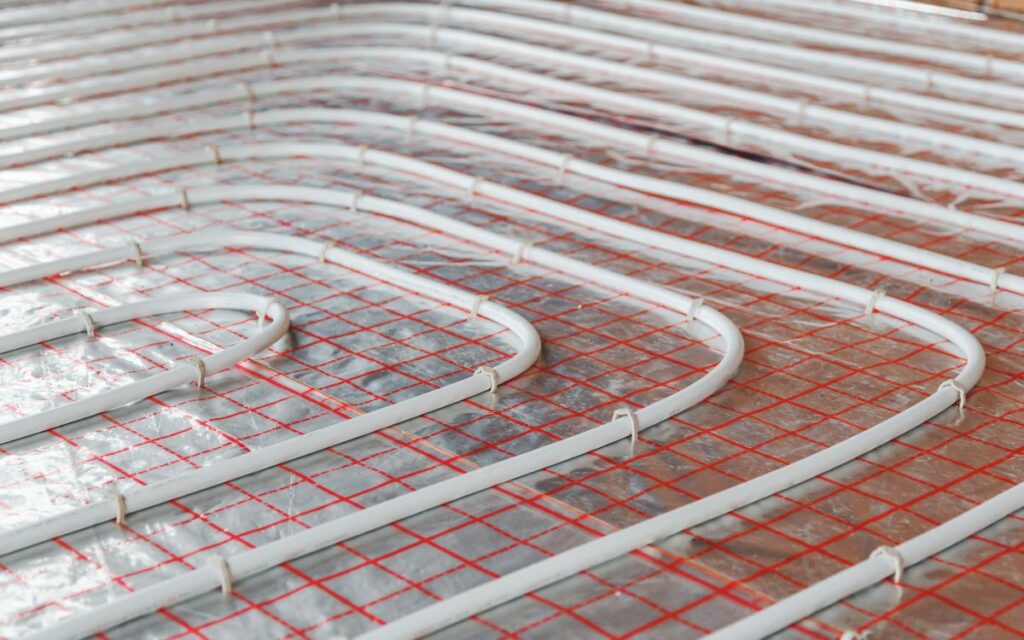 Hydronic radiant heating tubing installed on an exposed floor