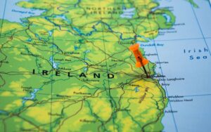 Closeup on a topgraphical map of Ireland, with a pin in Dublin