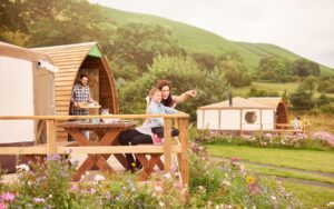 A family glamping along the lush countryside in Wales