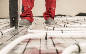 A homeowner installs radiant heating tubing in his home