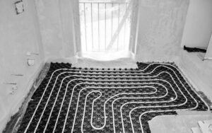 Radiant floor heating cables installed in the foyer on a home