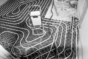 A radiant floor cooling system being installed on the flooring of a home