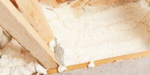 Rim joist insulation using spray foam to form an airtight seal.
