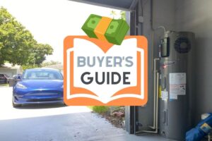 a blue tesla on the left and a heat pump water heater on the right inside the garage corner with a buyers guide symbol
