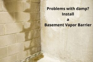 A damp corner of a basement constructed from cinder blocks. There are clear signs of water ingress and the words, "Problems with damp? Install a Basement Vapor Barrier" are overlain on the image.