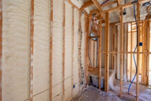 A interior wall with a spray foam insulation application