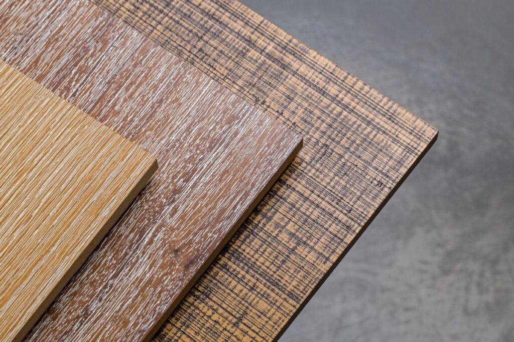 various types of hardwood and bamboo plywood sheets stacked on top of each other