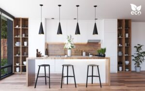 a white kitchen with eco wood countertops in a bright open living space