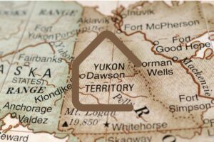 a brown map of yukon, canada, showing alaska's map on the left