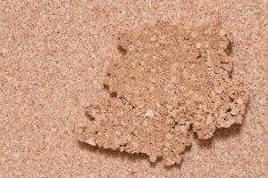 A segment of cork insulation sitting atop a full sheet