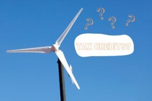 a small wind turbine on the left with a text bubble on the right that says Tax Credits?