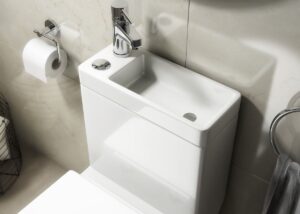 Closeup on the top of a toilet sink.