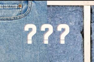 A split screen image of demin jeans on the left and denim insulations batts installed in an exposed wall at right