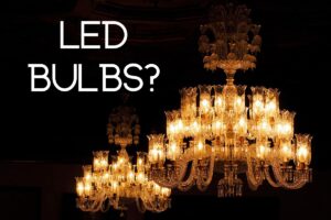 Two chandeliers glowing against a black backdrop, with the text "LED bulbs?" transposed at top left