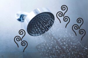 A low-flow showerhead with water coming out of it and graphics depicting steam transposed above the image