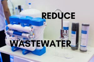 A reverse osmosis system next to a sink on a countertop, with the text "reduce wastewater" transposed above the image